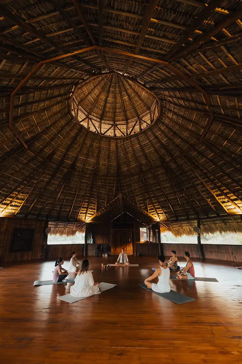 Guests sitting in an open-air integration circle at the retreat center